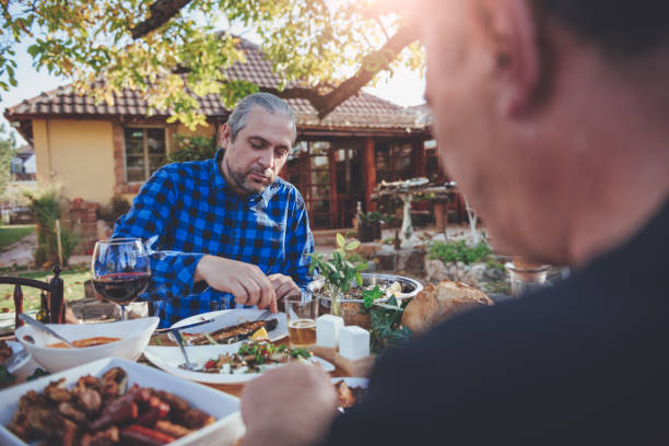 istock Family dining outdoor 880205440