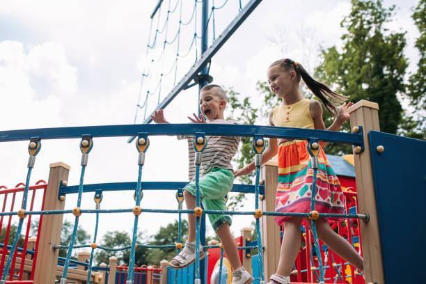 istock Little fidget children get fun in the park 880208002