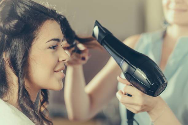 istock Drying hair in hair salon 880227110