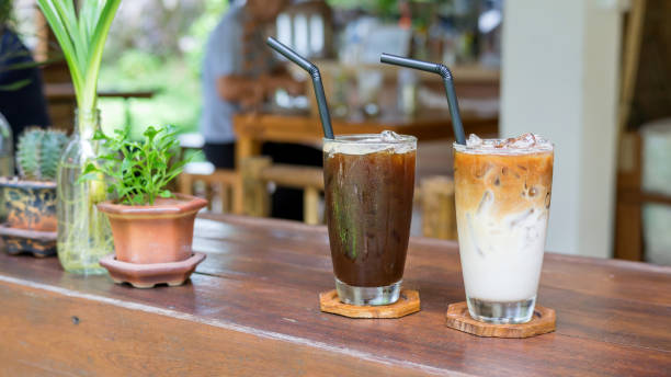 istock iced latte and americano coffee on a wooden table. 880236412