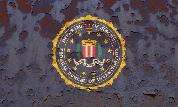 Flag of the Federal Bureau of Investigation Flag of the Federal Bureau of Investigation at the rusty background.  Concept photo fbi photos stock pictures, royalty-free photos & images