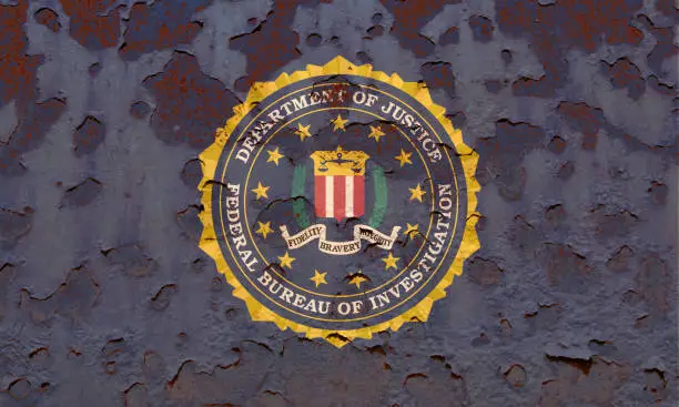 Flag of the Federal Bureau of Investigation at the rusty background.  Concept photo