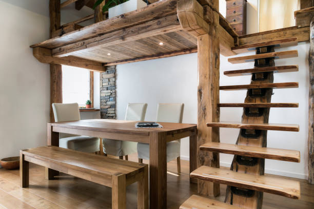 wooden table in dining room under mezzanine