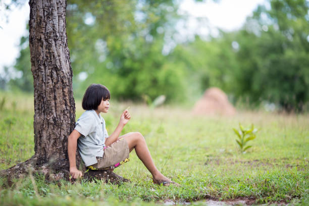 istock Child lonely alone in the farm. 880276764