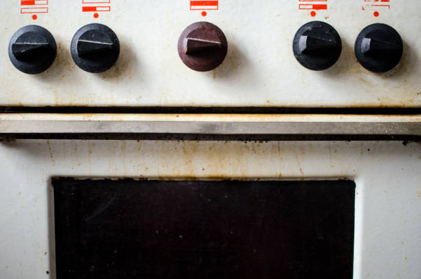 Dirty kitchen. Unsanitary conditions. Old gas stove "nin emergency condition with "nuneconomical gas consumption