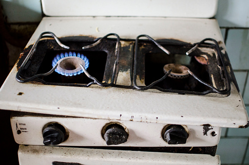 Dirty kitchen. Unsanitary conditions. Old gas stove \