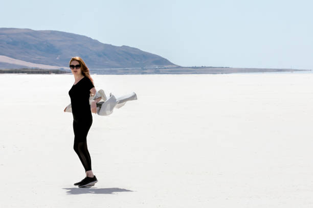 istock Woman at salt lake 880288332