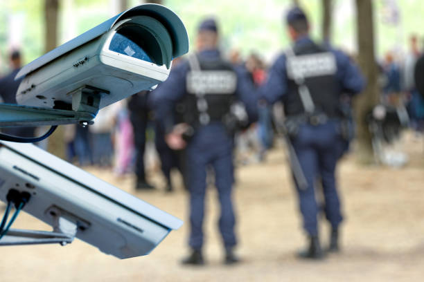 istock security CCTV camera or surveillance system with military on blurry background 880300452