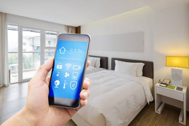 istock smart phone with smart home with modern bedroom 880328116