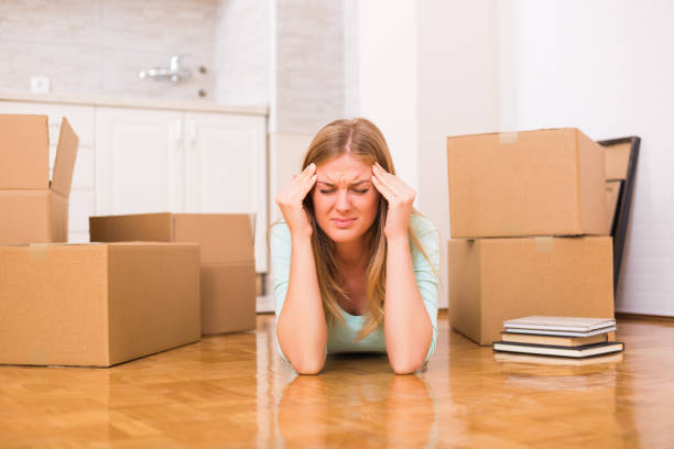 istock Headache because of moving into new home 880331072