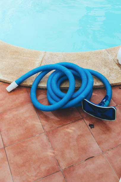 istock Pool cleaning equipment by the pool 880338696