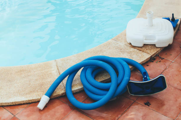 istock Pool cleaning equipment by the pool 880341148