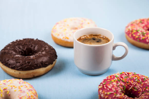 istock Donuts and a cup of coffee close-up 880344150