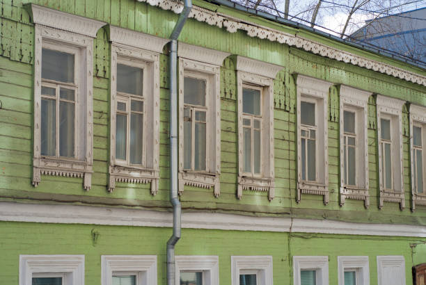 istock Old green wooden house with windows pattern 880353674