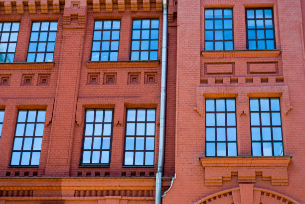 istock Industrial plant of red bricks with large windows 880353736