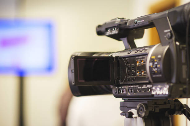 istock Professional video camera mounted on a tripod to record video during a press conference, an event, a meeting of journalists. 880356872