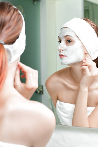 istock woman with a mask on her face 880372494