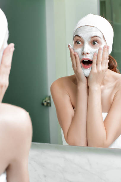 istock woman with a mask on her face 880375676