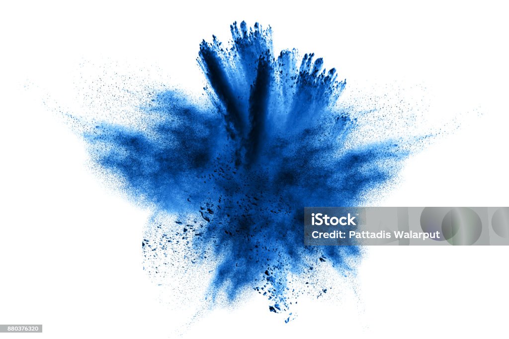 powder explosion.Powder explosion. Closeup of  blue dust particle explosion isolated on  background Exploding Stock Photo