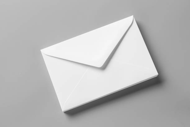 istock Blank portrait A4. blank realistic envelopes mockup on gray, changeable background / white paper isolated on gray 880385780