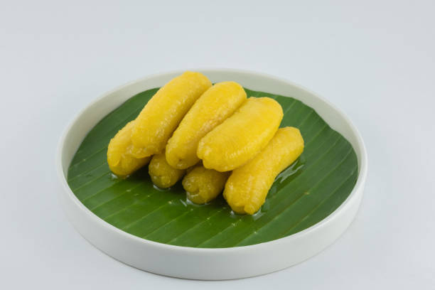 istock Preserved banana in syrup, Thai style, served on a white background. 880388734