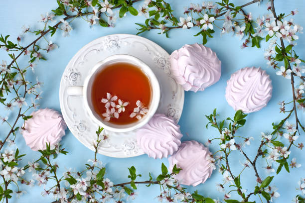 istock Still life with tea cup and  spring blossom flowers 880389314