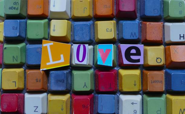 istock Word Love  lying on colorful keyboard background 880394790