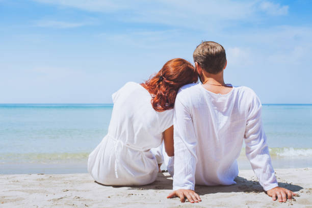 happy couple on the beach, summer holidays or honeymoon background