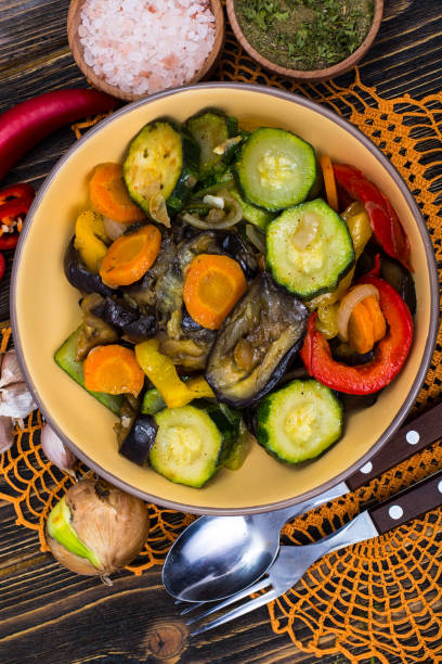 istock Grilled Vegetable Mix in Ceramic Bowl on Brown Plates 880404484
