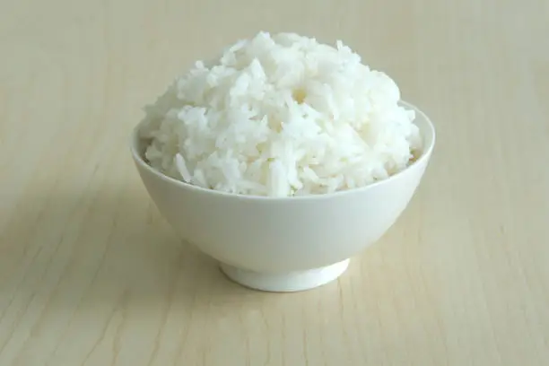 Photo of WHITE RICE BOWL ON WOOD TABLE