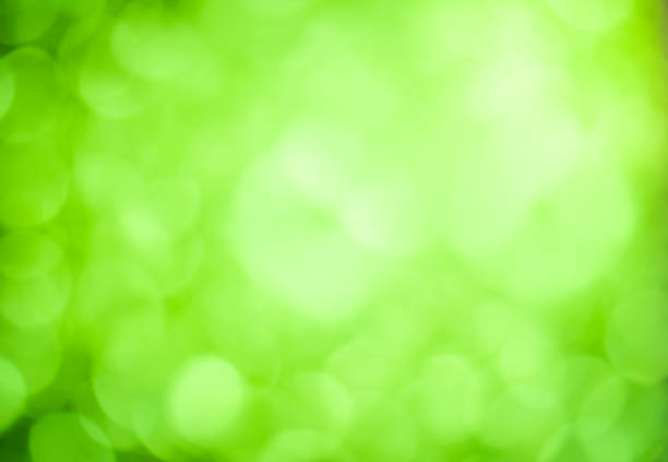 istock Abstract green background with lighting bokeh 880407838