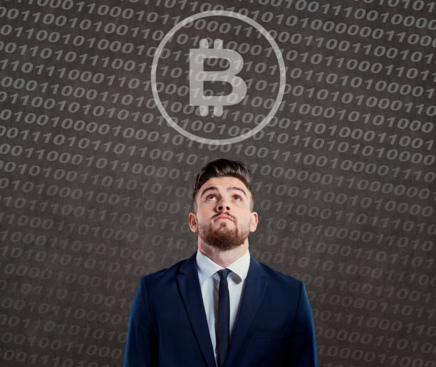 istock Businessman looking with question at bitcoin 880410382