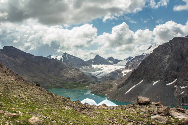 istock Reflecting lake Ala-Kol and rocks 880416762