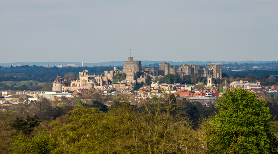 WINDSOR, ENGLAND -MAY, 24 2018: Windsor Castle, built in the 11th Century, is   the residence of the British Royal Family at Windsor in the English county of Berkshire, United Kingdom