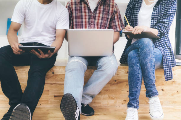 istock Young woman and man studying for a test or an exam.  Study group. 880417468