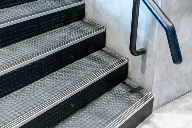 istock Non-slip stairs with dot pattern close up for background. Black rubber stairs. 880417602