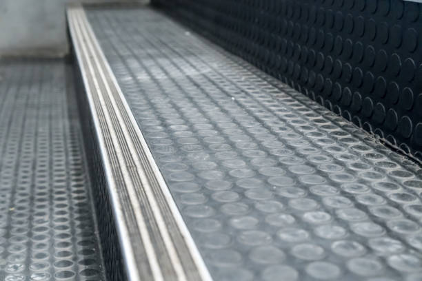 istock Non-slip stairs with dot pattern close up for background. Black rubber stairs. 880417606