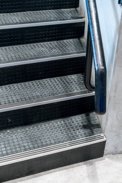 istock Non-slip stairs with dot pattern close up for background. Black rubber stairs. 880417610