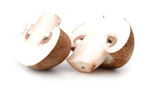 istock Fresh champignon mushrooms on white background 880424606