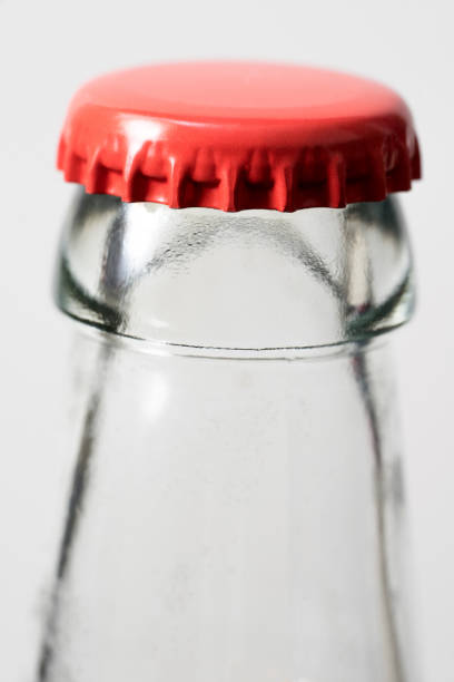 istock Glass bottle and red cap, white background. 880429790