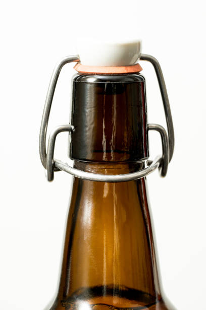 istock Brown glass bottle and marble cap, white background. 880429798
