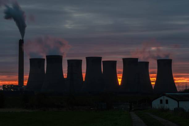 istock Power station in front of an orange sky 880441094