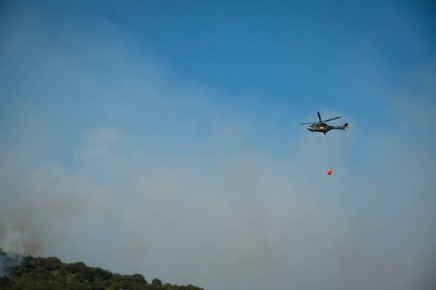 istock Helicopter extinguishing the forest fire in Montenegro 880459680