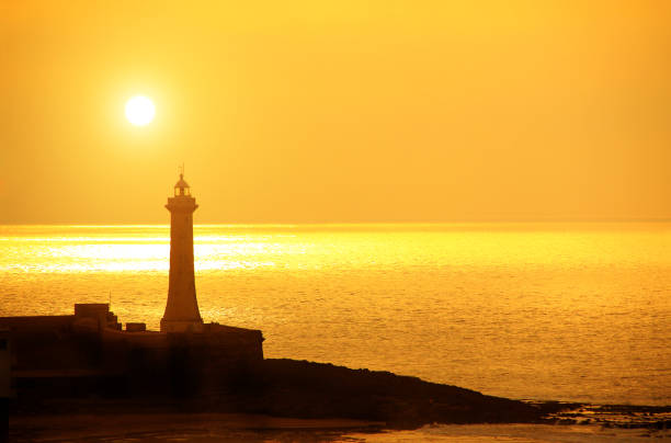 istock Lighthouse on sunset background, Kasbah of Udayas, Rabat,  Morocco 880459768