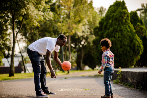 istock Father and son playing with the ball. 880462686
