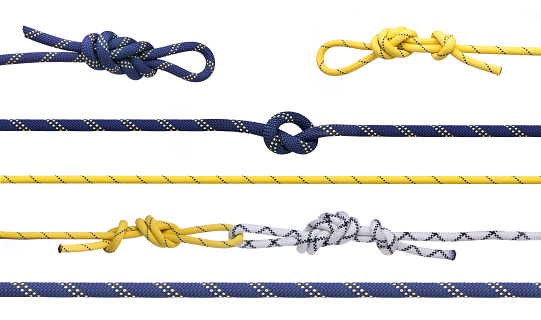 Group of climbing ropes and knots and loops.  Set of mountaining ropes isolated on white background