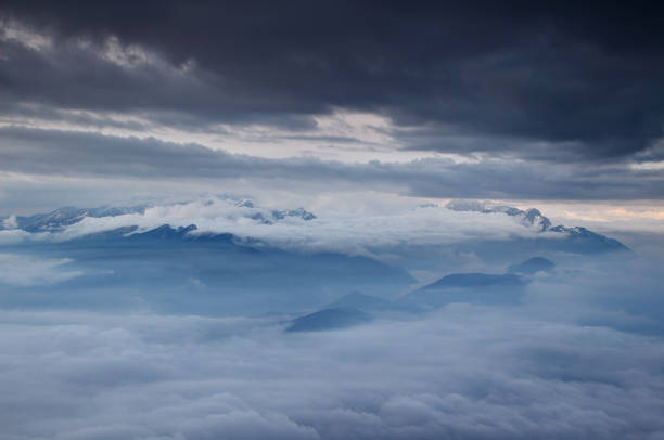 Photo of Julian Alps blanketed in sea of low level clouds and autumn fog