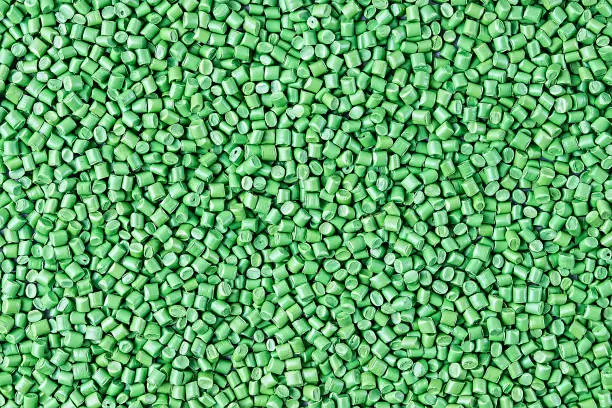 Photo of Background of plastic granules. Polymeric pellets. Colorant for plastics.