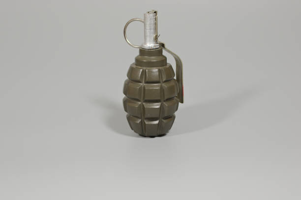 istock A hand grenade in landscape orientation with copy space. 880472112