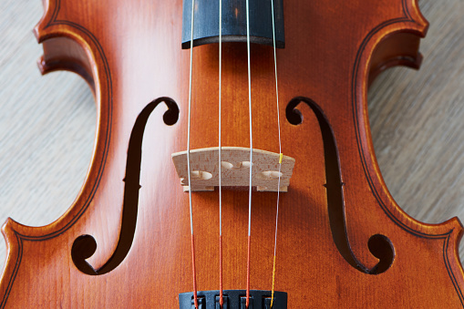 Sound holes of a brown violin